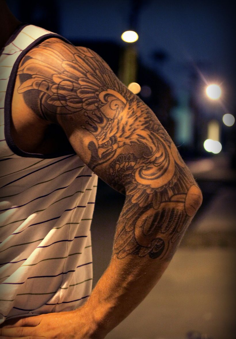 Amazing Realistic Black And Grey Phoenix With Crown Tattoo With Arm with regard to size 820 X 1175