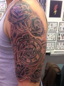 Black And Grey Rose Flowers And Sports Tattoo On Half Sleeve inside sizing 768 X 1024