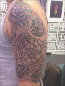 Black And Grey Rose Flowers And Sports Tattoo On Half Sleeve throughout size 776 X 1032