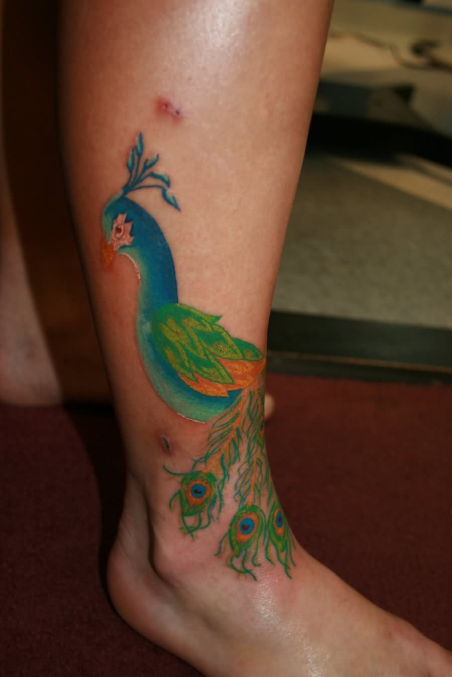 Colored Peacock Ankle Tattoo inside proportions 900 X 1348