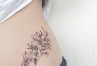 Grey Small Lily Flowers Tattoo On Lower Back in sizing 1000 X 1000