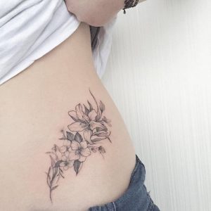 Grey Small Lily Flowers Tattoo On Lower Back in sizing 1000 X 1000