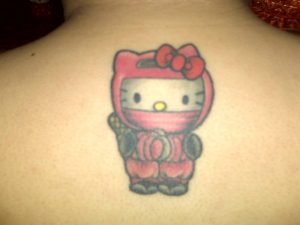 Ninja Hello Kitty Tattoo On Man Upper Back regarding measurements 1600 X 1200