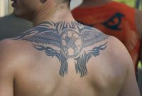 Tribal And Winged Circle Back Tattoo For Men throughout measurements 1024 X 768