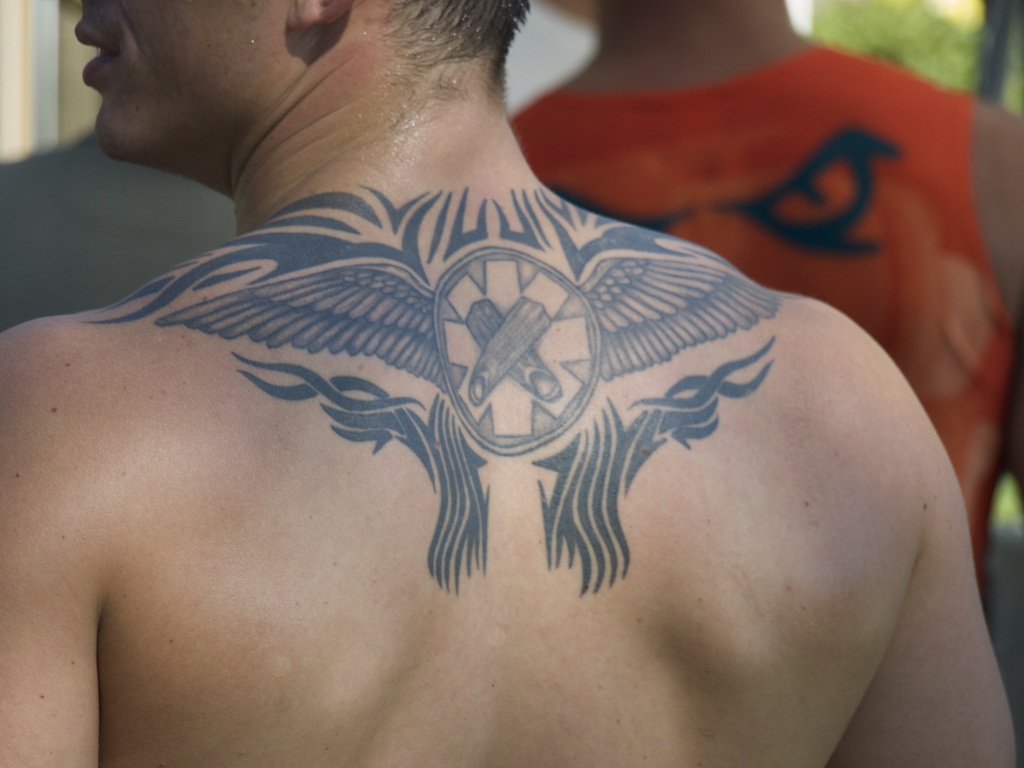 Tribal And Winged Circle Back Tattoo For Men throughout measurements 1024 X 768