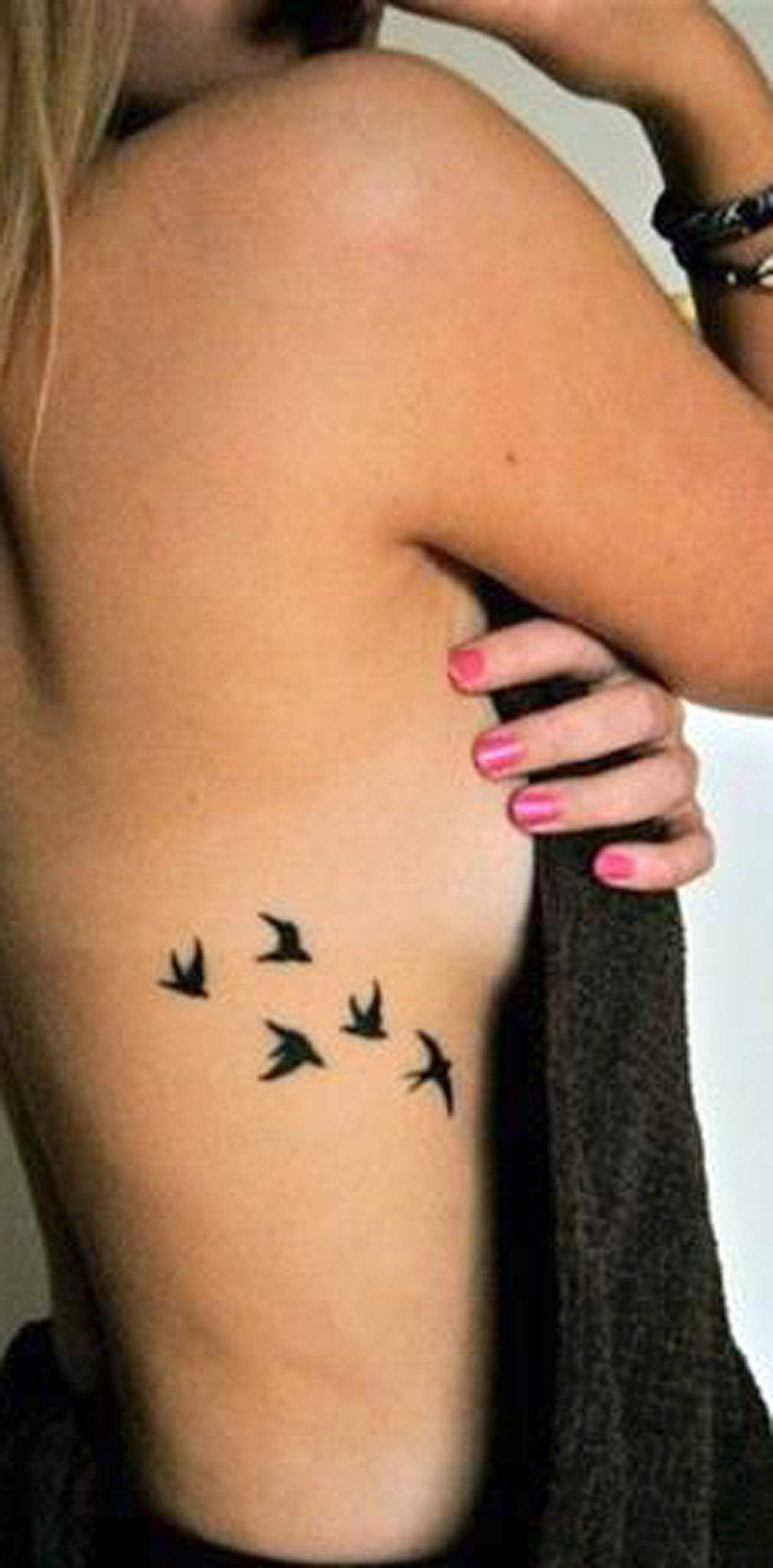 30 Feminine Rib Tattoo Ideas For Women That Are Very Inspirational inside measurements 1009 X 2048