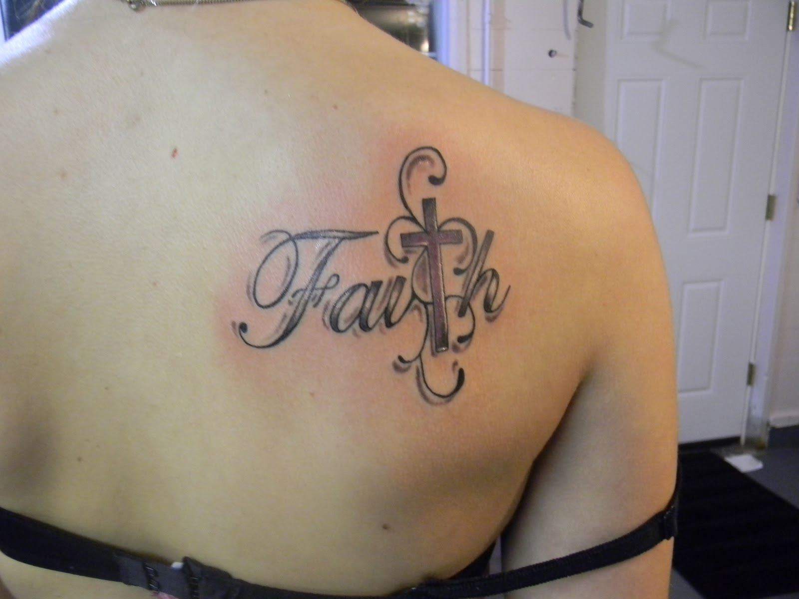 Black And Grey Faith With Cross Tattoo On Girl Upper Back pertaining to measurements 1600 X 1200