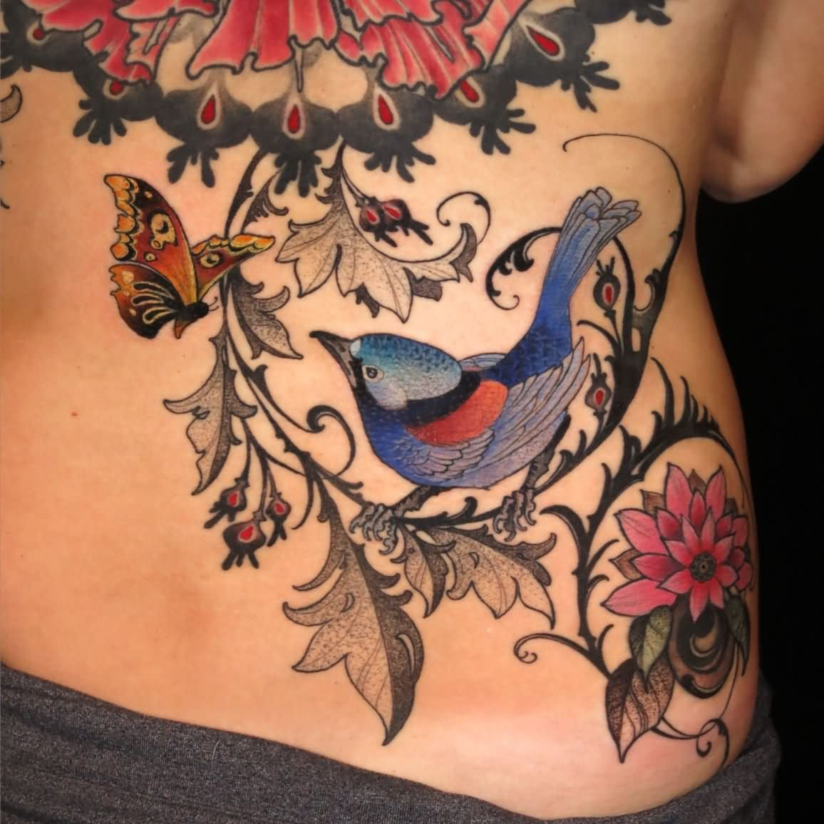 Colorful Bird On Branch With Flying Butterfly Tattoo On Lower Back with regard to size 1156 X 1156