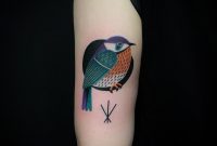 Colorful Small Bird Tattoo Inked On The Back Of The Left Upper Arm for dimensions 960 X 960