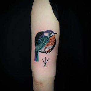 Colorful Small Bird Tattoo Inked On The Back Of The Left Upper Arm for dimensions 960 X 960