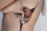 Koit Tattoo Berlin Red Brown And Black Ron Bird Rib Tattoo within measurements 1226 X 1920