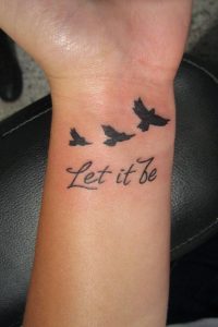 Let It Be Writing And Flying Birds Tattoo On Wrist Tattoo Mania for measurements 1067 X 1600
