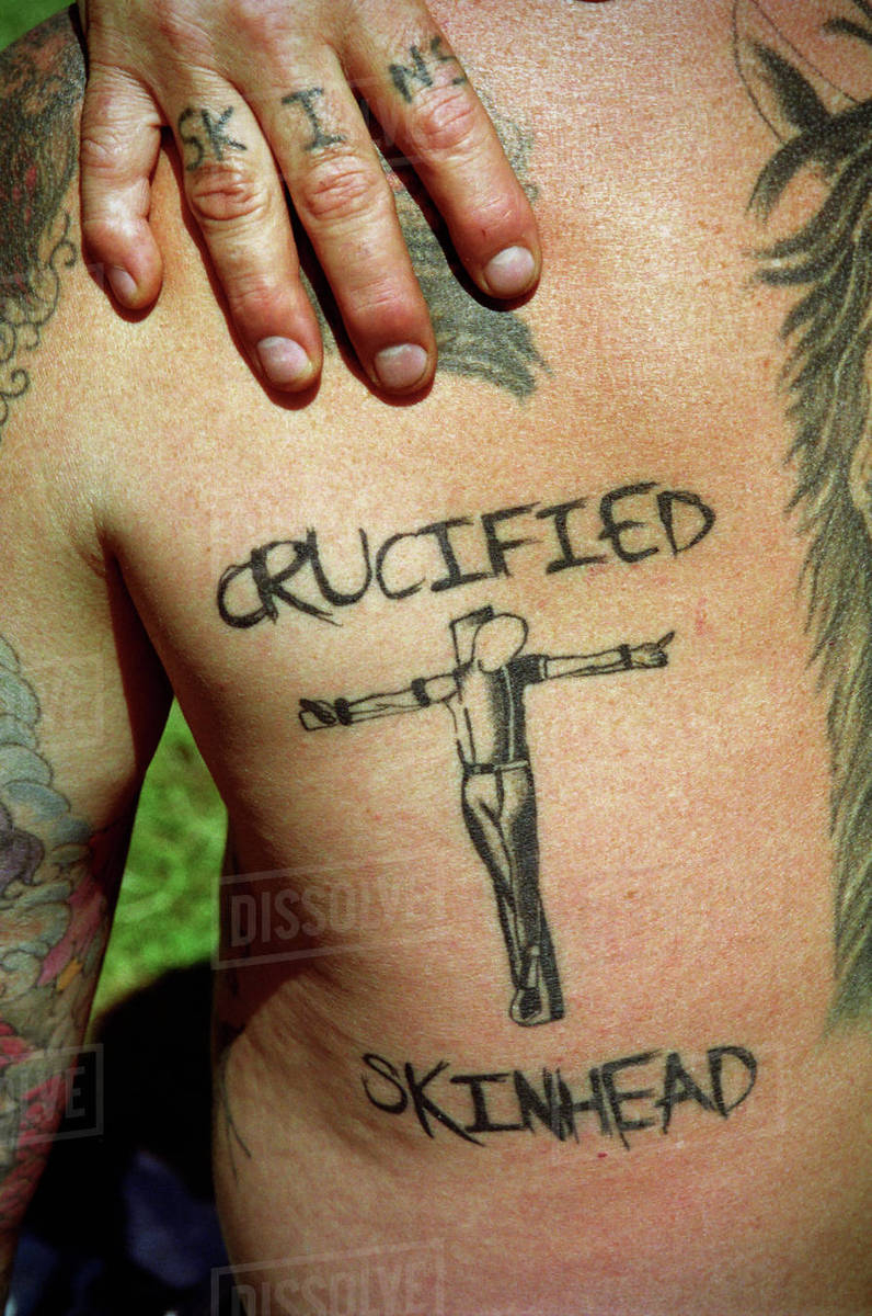 Man With Tattoo Of Skinhead On Cross Stock Photo Dissolve with regard to pr...