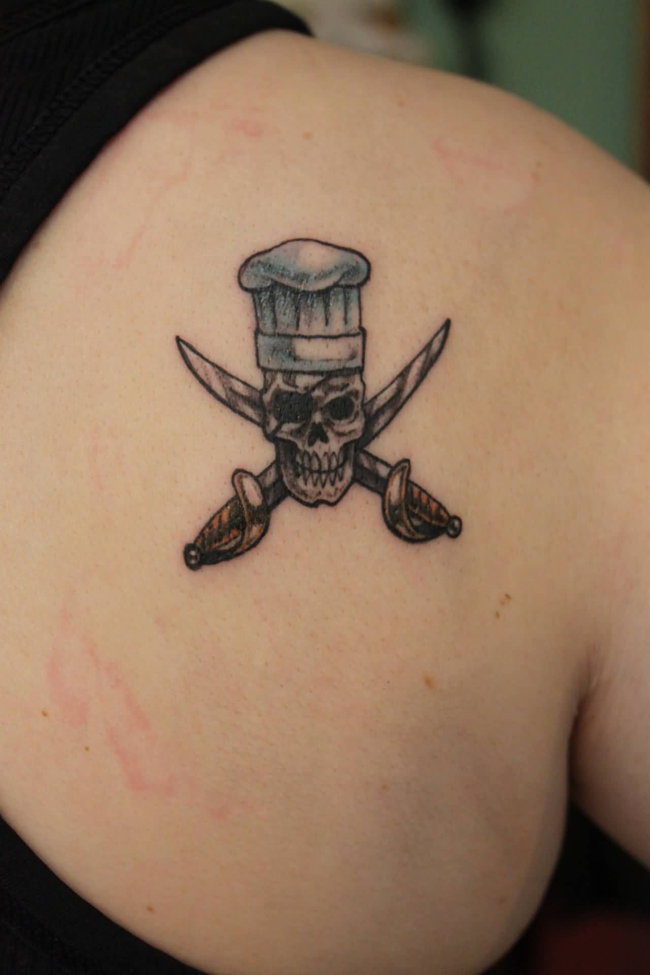 Tiny Chef Skull With Crossed Swords Tattoo On Right Back Shoulder in sizing 1280 X 1920