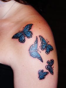 Black And Blue Butterflies Tattoo On Girl Left Shoulder inside measurements 1200 X 1600