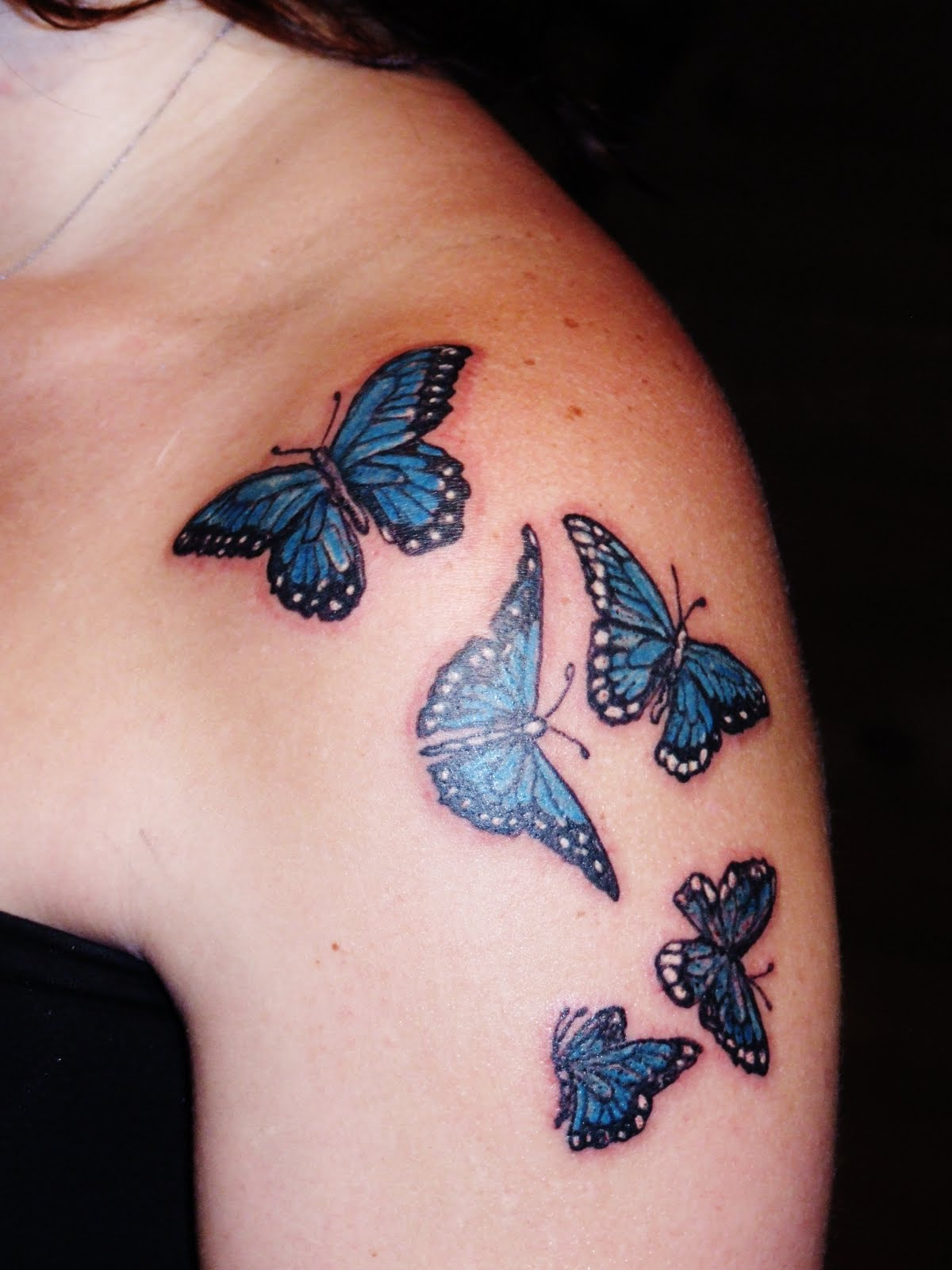 Black And Blue Butterflies Tattoo On Girl Left Shoulder inside size 1200 X 1600