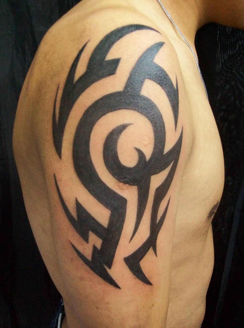 Black Ink Famous Tribal Tattoo On Upper Arm For Guys Truetattoos in proportions 1024 X 1372