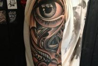 Black White Eye Held In Hands Tattoo On Bicep Gothic Tattoo Uk in proportions 940 X 1253