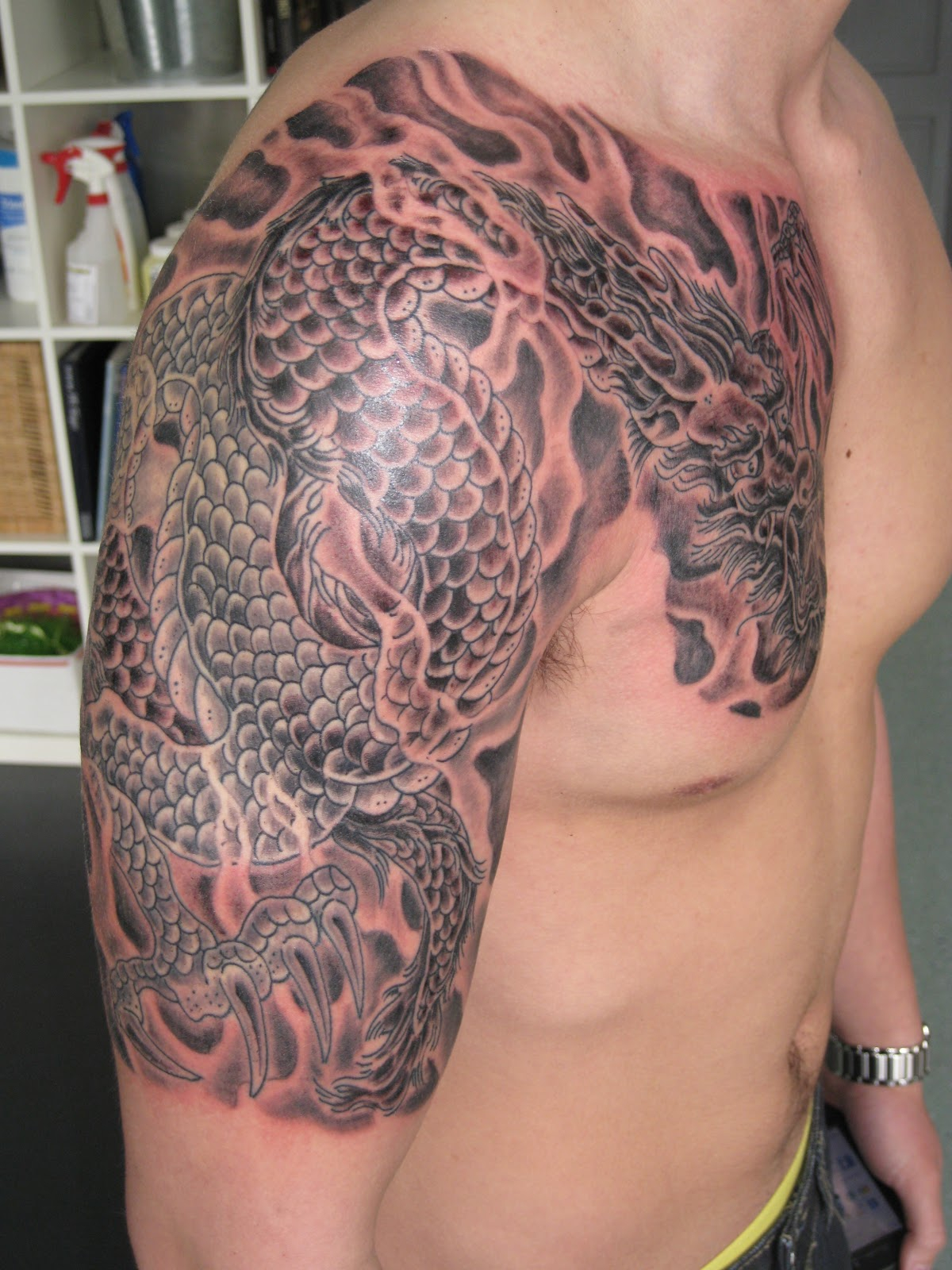 Grey Ink Dragon Tattoo On Chest And Shoulder pertaining to sizing 1200 X 1600