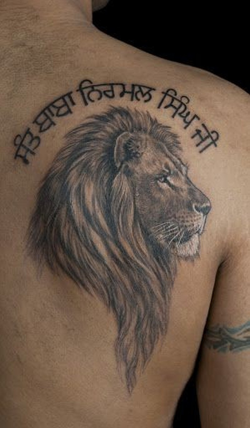 Lion Head With Inscription Tattoo On Shoulder Blade Tattoos Book regarding size 800 X 1370