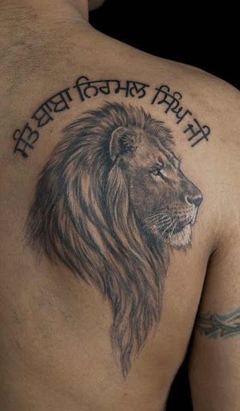 Lion Head With Inscription Tattoo On Shoulder Blade Tattoos Book throughout dimensions 800 X 1370