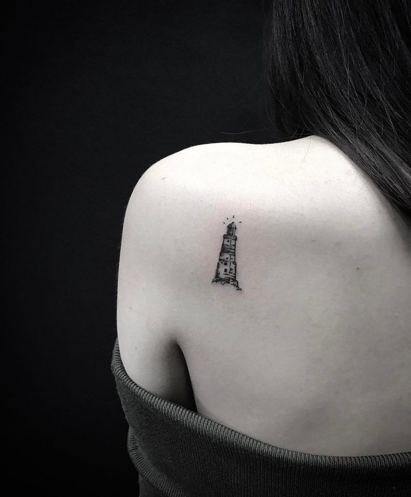 Small Black And Grey Lighthouse Tattoo On The Left Shoulder Blade with dimensions 846 X 1024