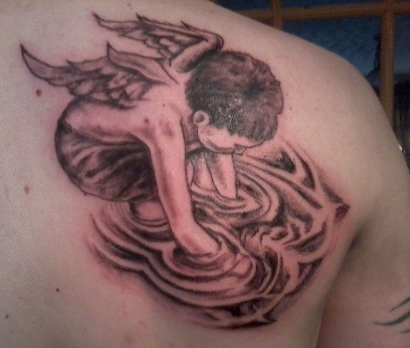 Winged Cupid Water Tattoo On Back Shoulder Tattoo Ideas Cherub regarding si...