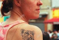 Young French Woman With A Big Cat Tattoo On Her Shoulder And Stock regarding proportions 878 X 1390