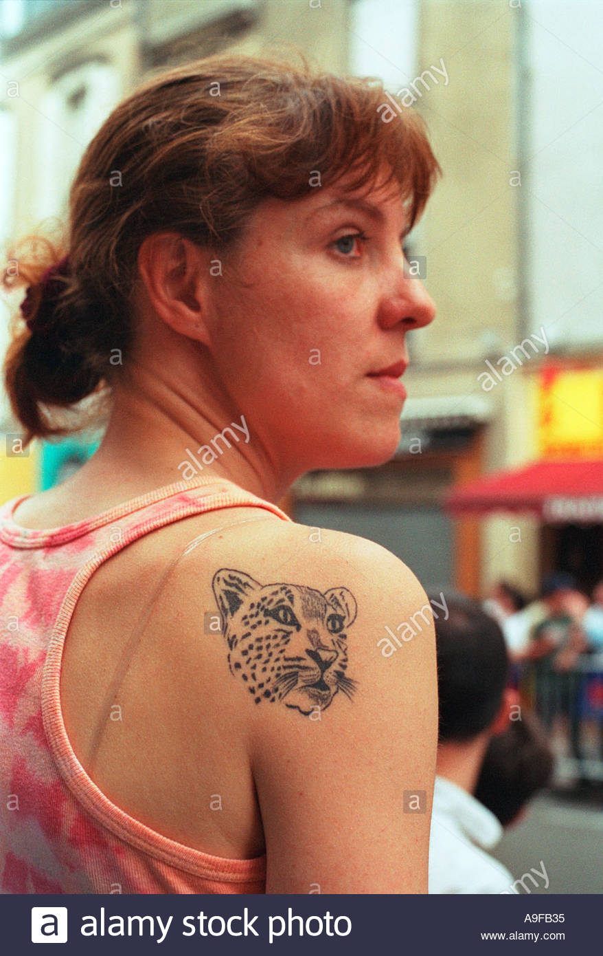Young French Woman With A Big Cat Tattoo On Her Shoulder And Stock regarding proportions 878 X 1390