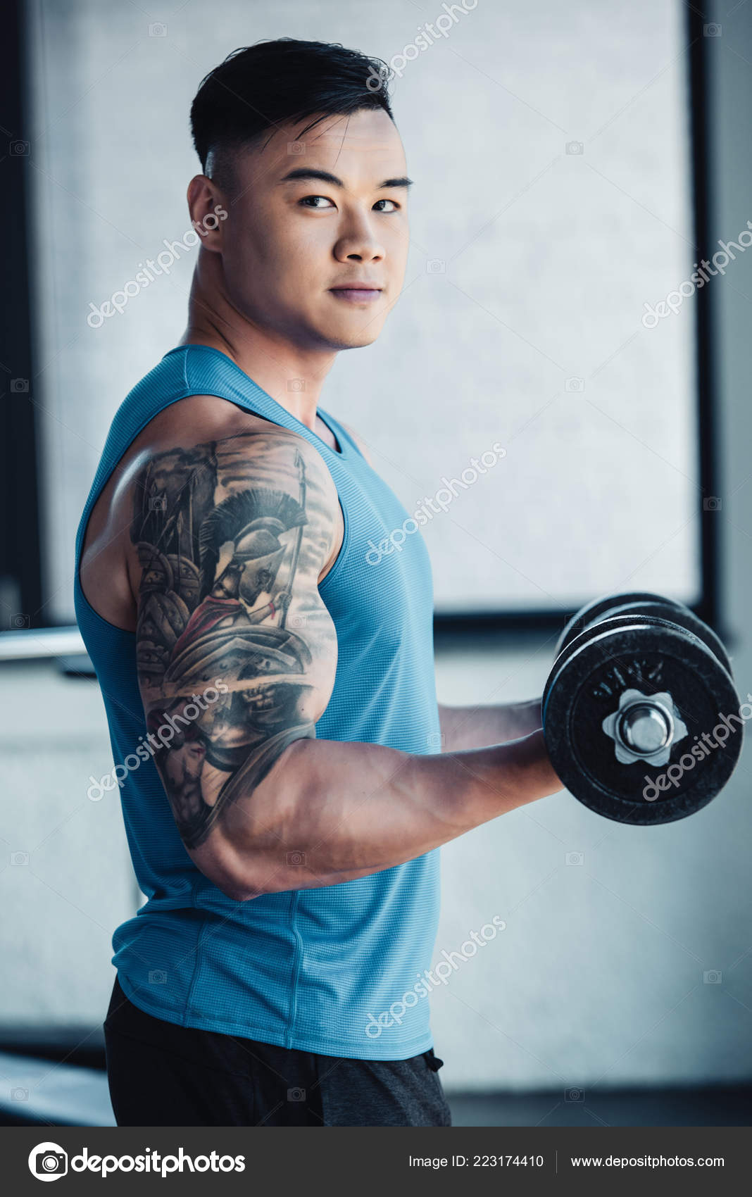 Young Tattooed Asian Sportsman Exercising Dumbbell Gym Looking within sizing 1068 X 1700