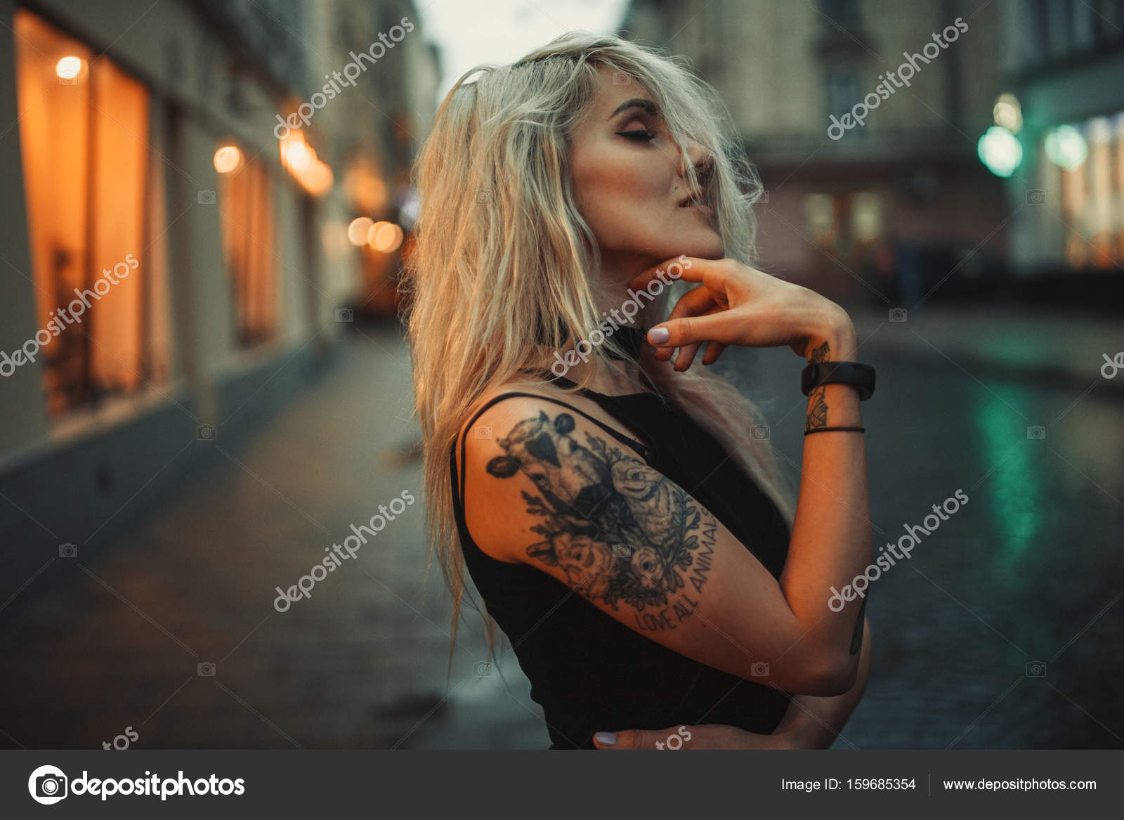 Young Woman Portrait With Tattoo On Shoulder Standing On City Street regarding proportions 1600 X 1167